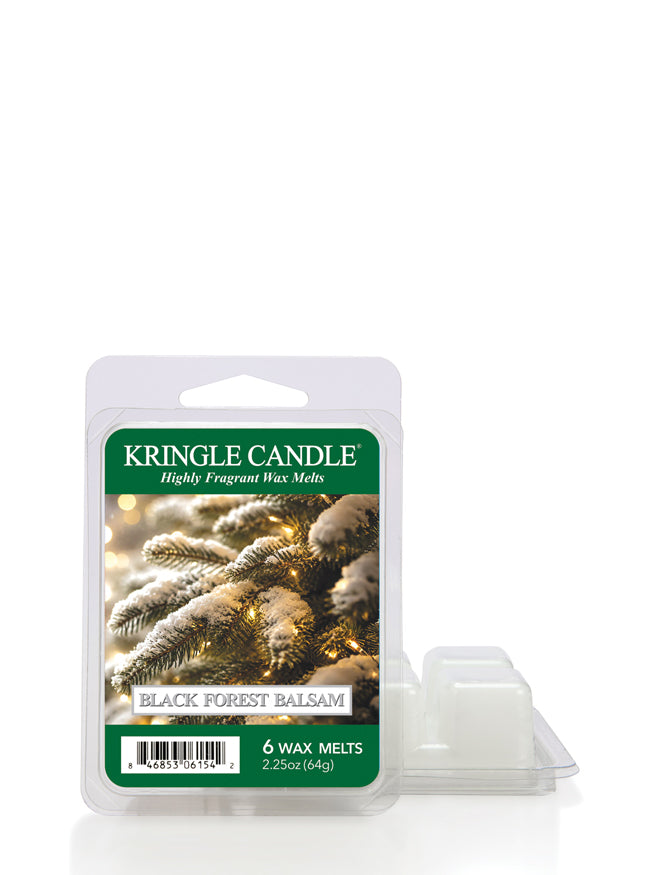 Kringle Candle Black Forest Balsam 6-wax melts in a clear plastic clamshell package with a green label, shown next to two small white wax melts on a white background.