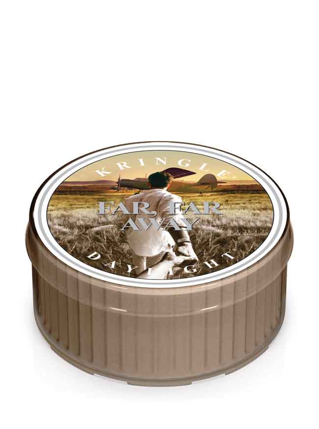 Photo of Kringle Candle's Far, Far Away citrus scented Daylight candle with a label showing a man holding a woman's hand and leading her away to take a flight on a prop plane off in the distance.